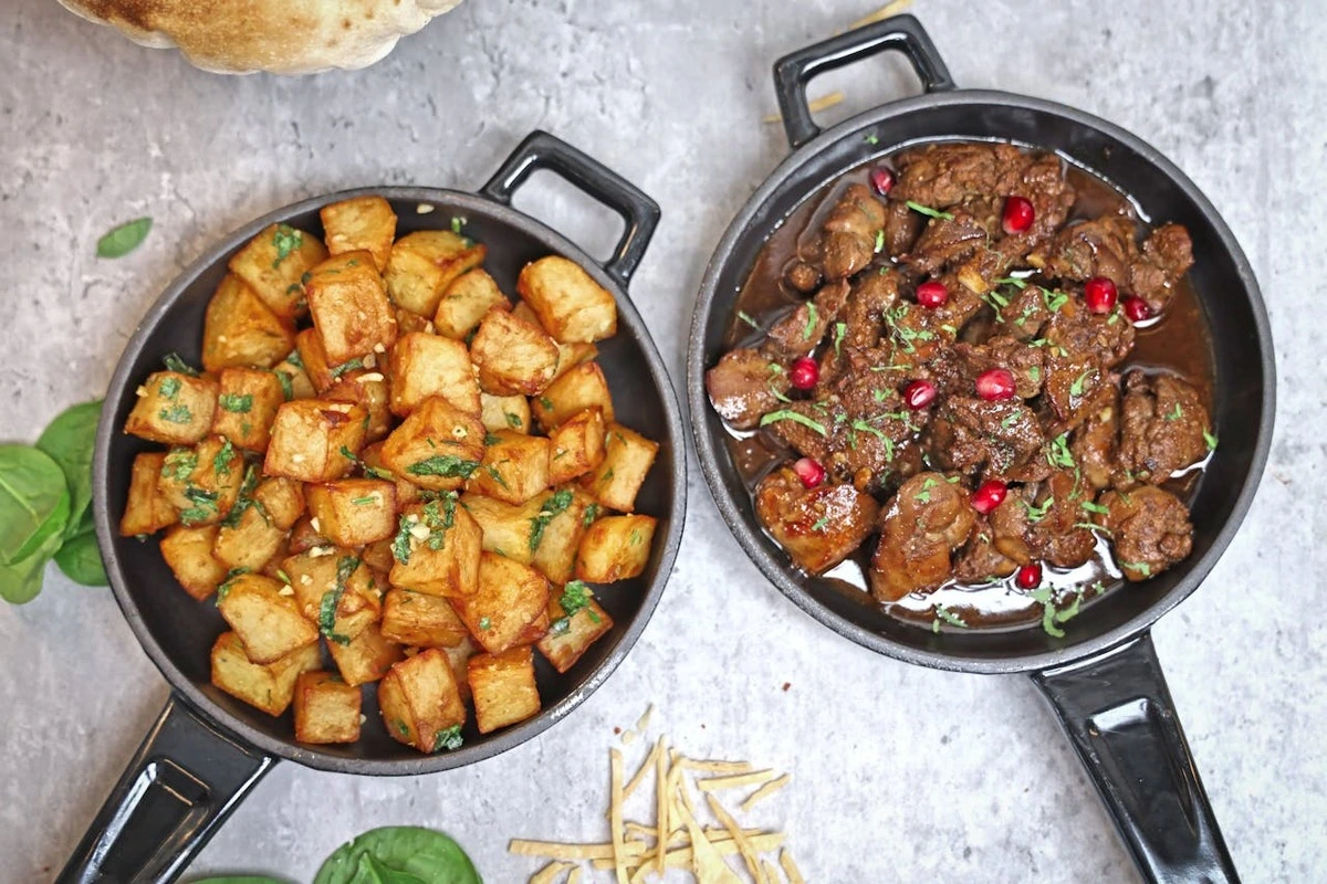 Cast iron skillet with steak and resemary